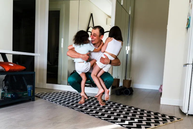 HVAC Refrigerant Changes Are Coming—Here’s How to Prepare. A father playing with his two kids.