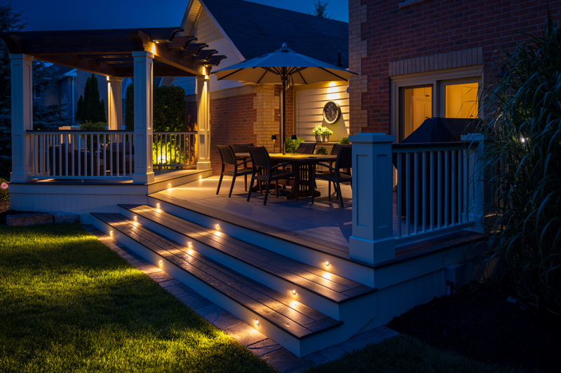 Outside of house with soft lighting at night.
