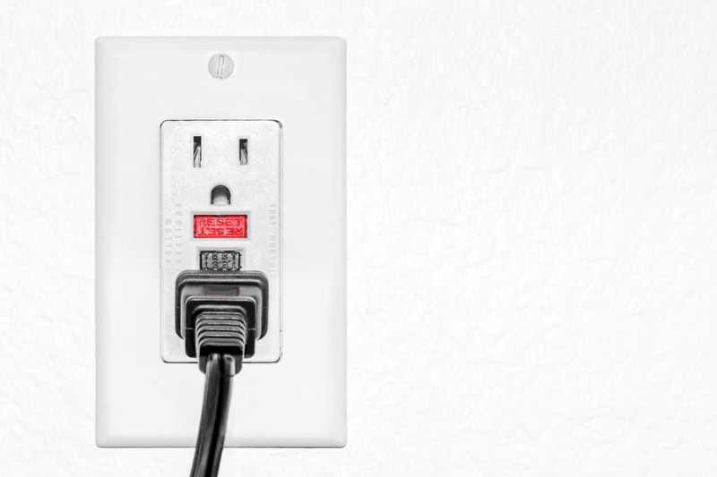 Ground fault circuit interrupter red reset and black test button to prevent electric  shock.