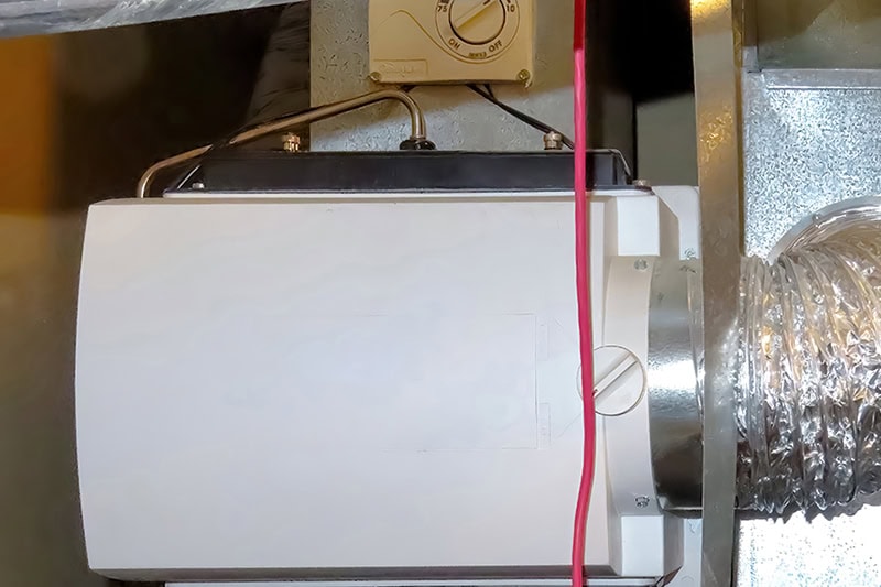 A home humidifier attach to the return duct with a bypass connection to the supply hot air duct.