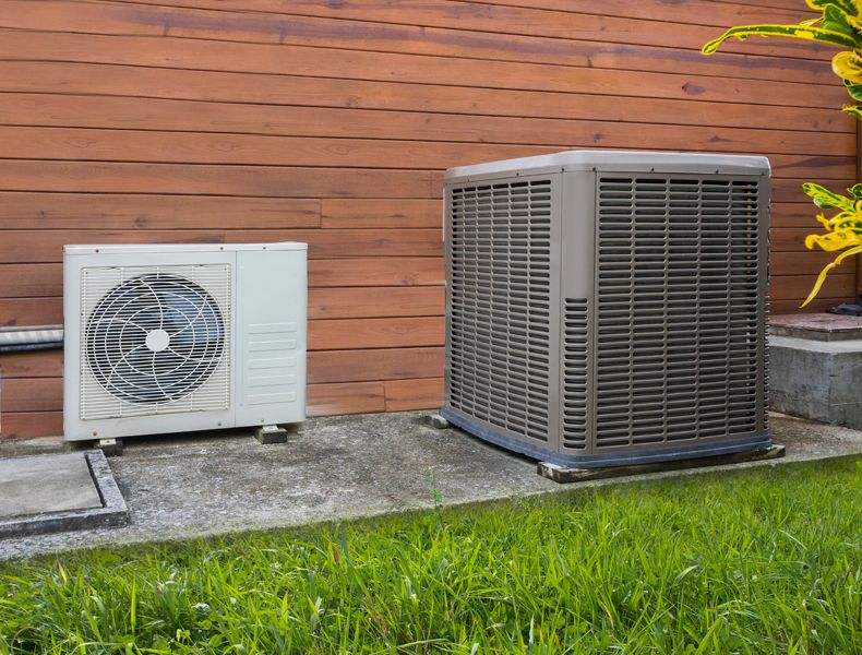 Transitioning Your Heat Pump. Heat Pump on home exterior.