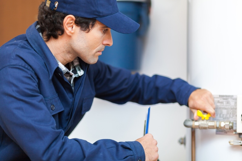 Plumber repairing an hot-water heater